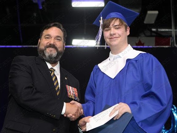Bedford Branch 95 Poppy Campaign Chairman Robert Pitcher presented Alexander Boha with a $1000 bursary during the CP Allen Graduation 2022