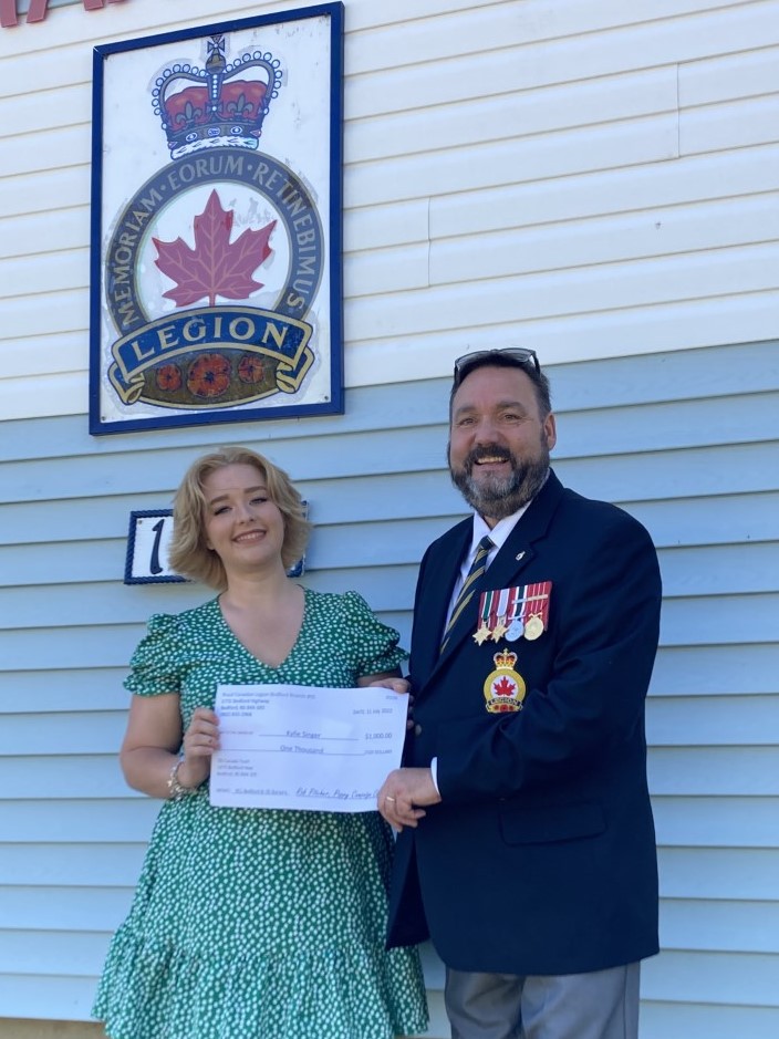Bedford Branch 95 Poppy Campaign Chairman Robert Pitcher presented Kylie Singer with a $1000 bursary