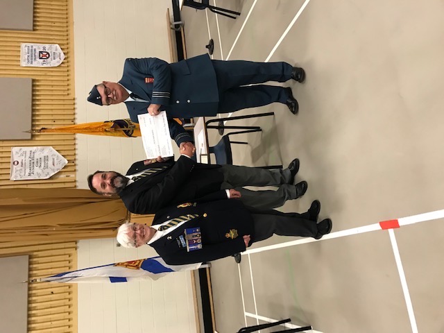 Bedford Legion President Comrade Joyce Pitcher joins Poppy Campaign Chairman, Comrade Rob Pitcher as they present a Certificate of Appreciation to Bedford Lions Air Cadet Sqn 342 Commander, Capt Andrew Konning for the support 342 Sqn provided during the 2021 Poppy Campaign