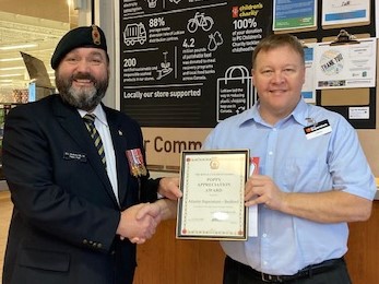 Comrade Rob Pitcher presents Steve Cox from The Atlantic Superstore Bedford with a Certificate of Appreciation for their assistance during the 2022 Poppy Campaign