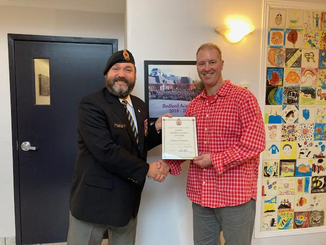 Comrade Rob Pitcher presents Jeff Sangster from Bedford Academy with a Certificate of Appreciation for their assistance during the 2022 Poppy Campaign