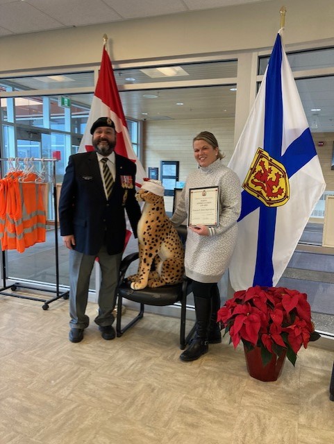 Comrade Rob Pitcher presents Nancy Martin from Charles P Allen Highschool with a Certificate of Appreciation for their assistance during the 2022 Poppy Campaign
