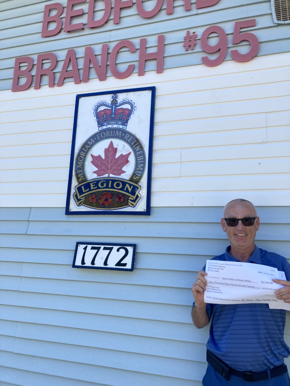 Heroes Haven of Hope organizer, Phil Reddy receives a cheque for $1920 from the Bedford Legion