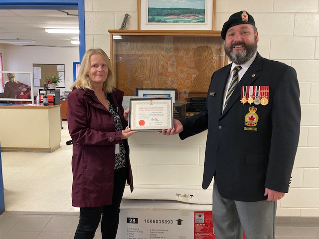Lisa Corkum from Hammonds Plains Consolidated School is presented with a Certificate of Appreciation for their assistance during the 2022 Poppy Campaign by Comrade Rob Pitcher