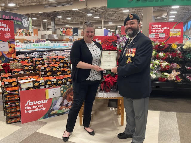 Lindsay Leblanc from The Sobeys on Larry Uteck is presented with a Certificate of Appreciation for their assistance during the 2022 Poppy Campaign by Comrade Rob Pitcher